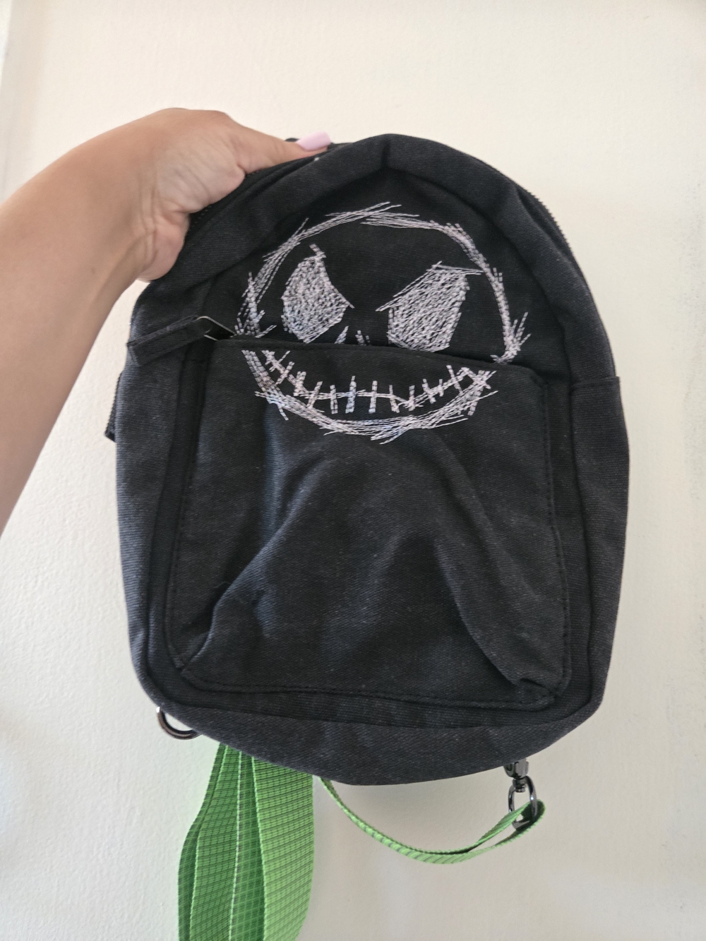 Disney Black Canvas Sling Bag with White Sketch Face and Green Strap